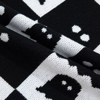 Black and white checkerboard ghost sweater with long ribbed sleeves