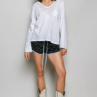 Off white V-neck long-sleeve knit top with contrast hand-stitched trim and chest pocket.