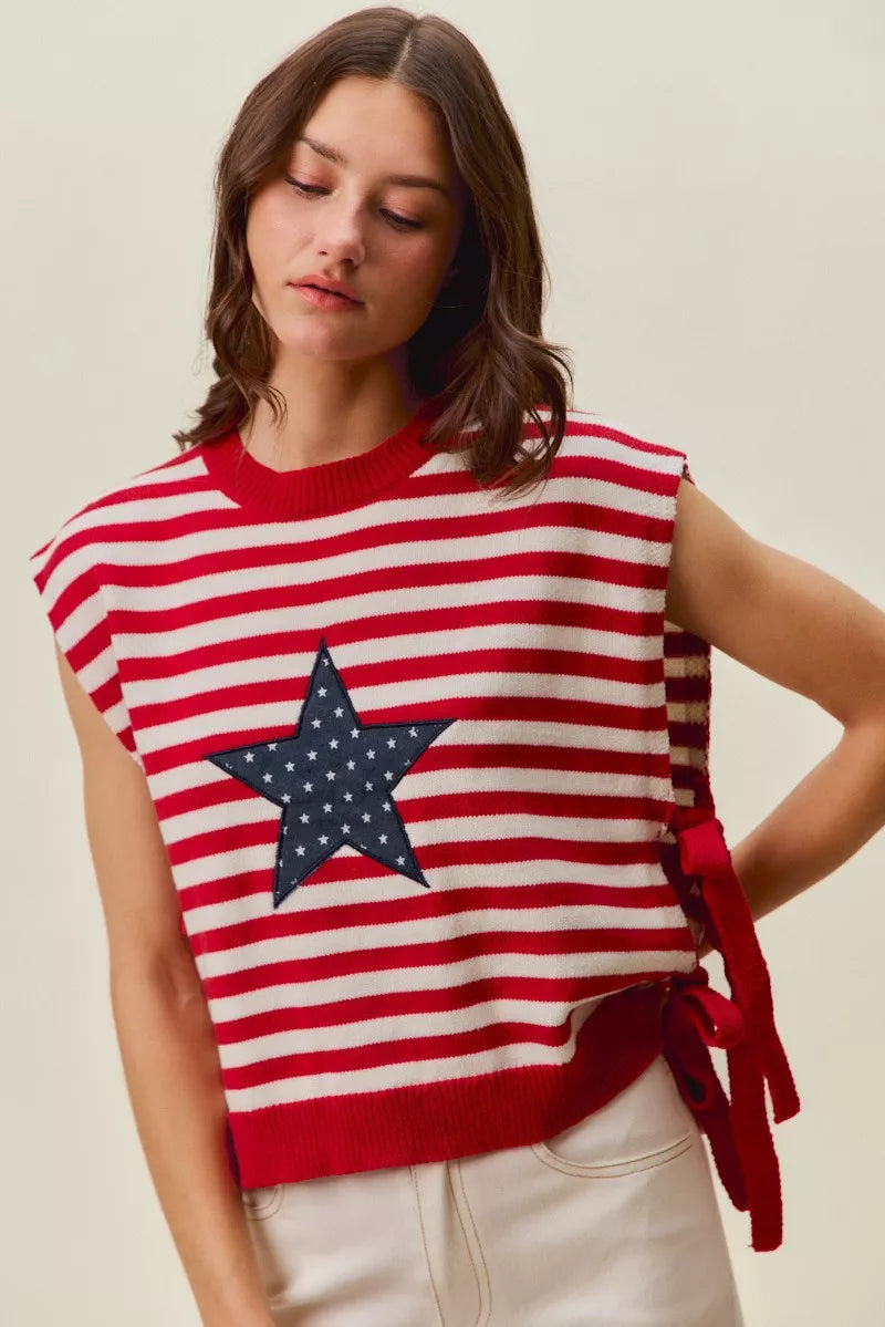 Red and ivory striped sleeveless vest top featuring navy star patch and side ties