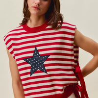 Red and ivory striped sleeveless vest top featuring navy star patch and side ties