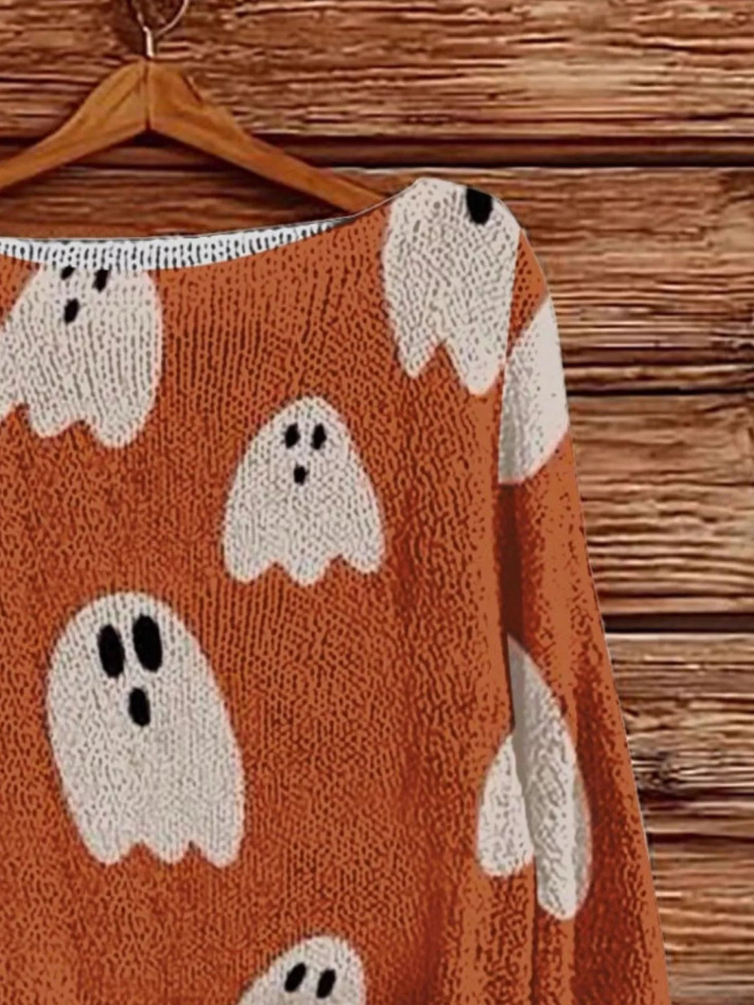 Plus-size orange Halloween boat-neck sweater with large ghost and pumpkin pattern detail