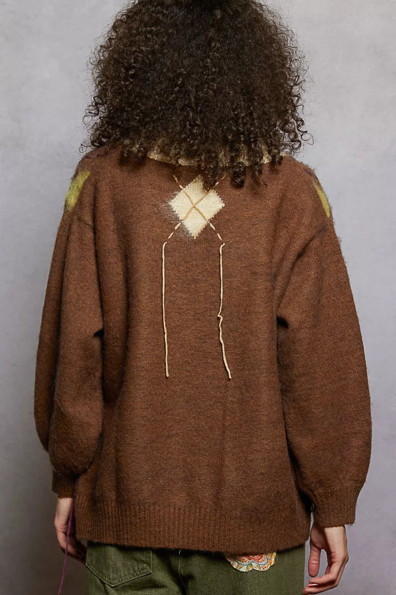 Back view of mocha argyle mohair V-neck sweater with diamond motif and exposed contrast stitch detail