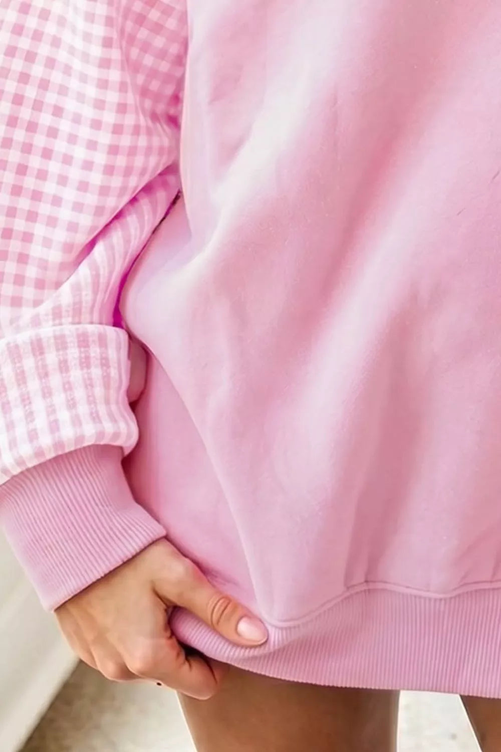 Blush pink tunic sweatshirt with plaid check sleeve detail and ribbed cuff