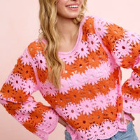 Floral crochet knit sweater top in orange and pink, long sleeves, scoop neck.