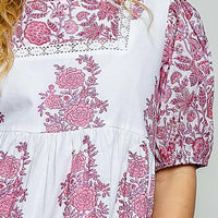 Close-up of ivory and pink floral hand-block print woven blouse front