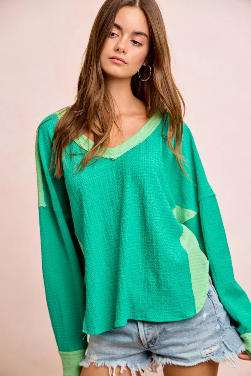 Textured jersey color block top, emerald green with light green panel detail at side seam
