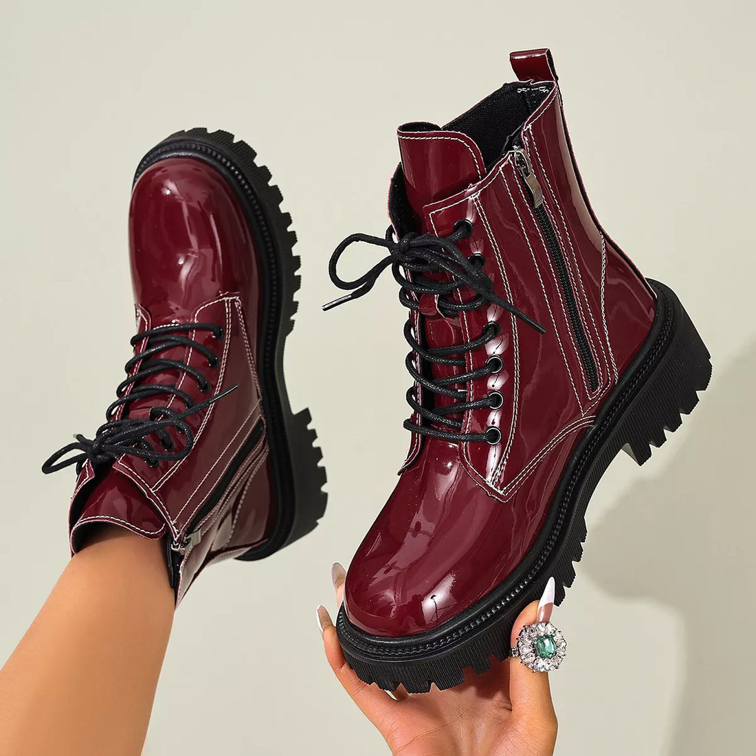 Burgundy patent lace-up block heel ankle boots with black side zipper and deep tread