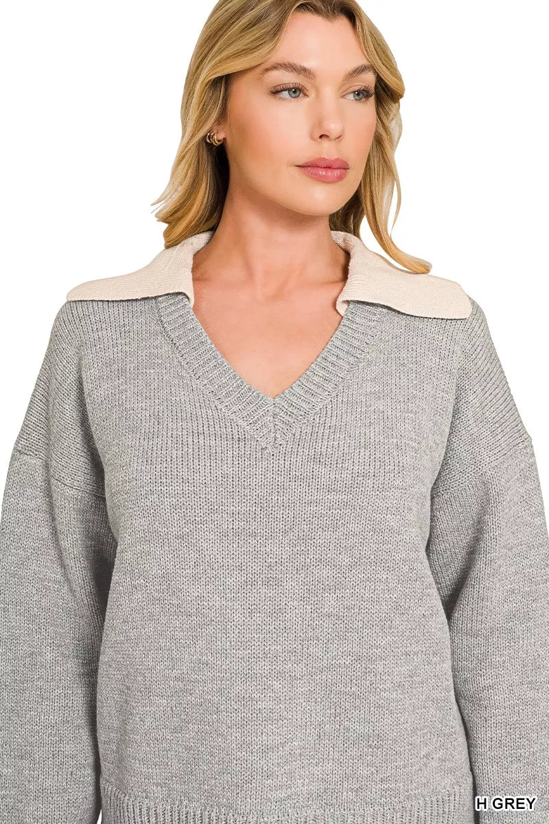 Grey V-neck sweater with wide knit collar and ribbed knit hem, relaxed fit