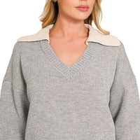 Grey V-neck sweater with wide knit collar and ribbed knit hem, relaxed fit