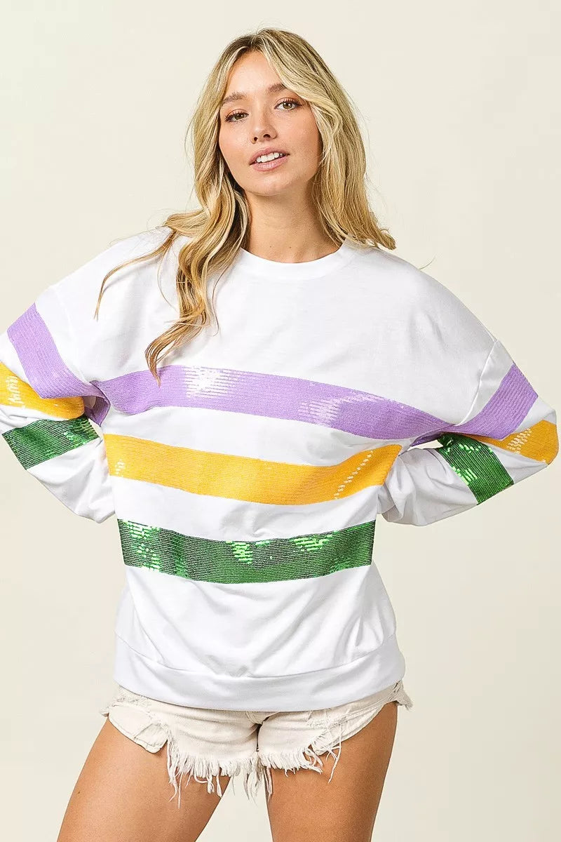 White crew-neck sweatshirt with sparkling sequin stripe banding in purple, yellow, green