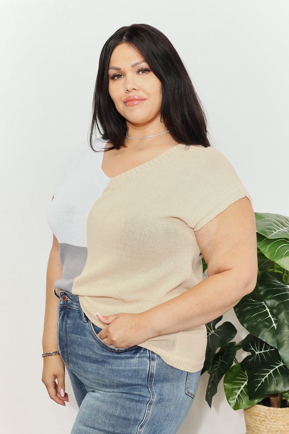Beige color-block knit V-neck top with short sleeves; gray panel along side