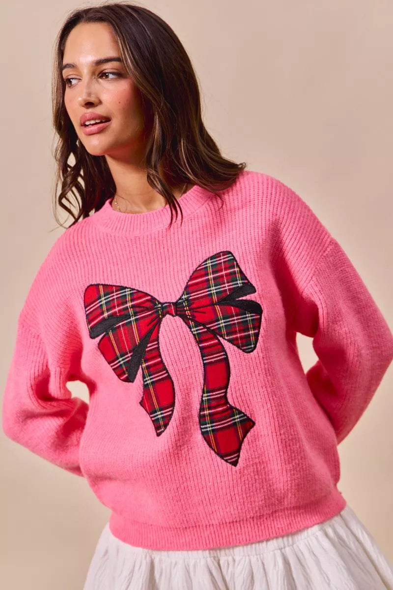 Pink sweater with plaid ribbon bow graphic