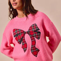 Pink sweater with plaid ribbon bow graphic