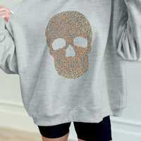 Gray loose-fit mock-neck pullover sweatshirt with rhinestone-style skull graphic