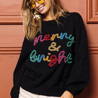 Black sweater with multicolor tinsel "Merry & bright" lettering, crewneck front view.
