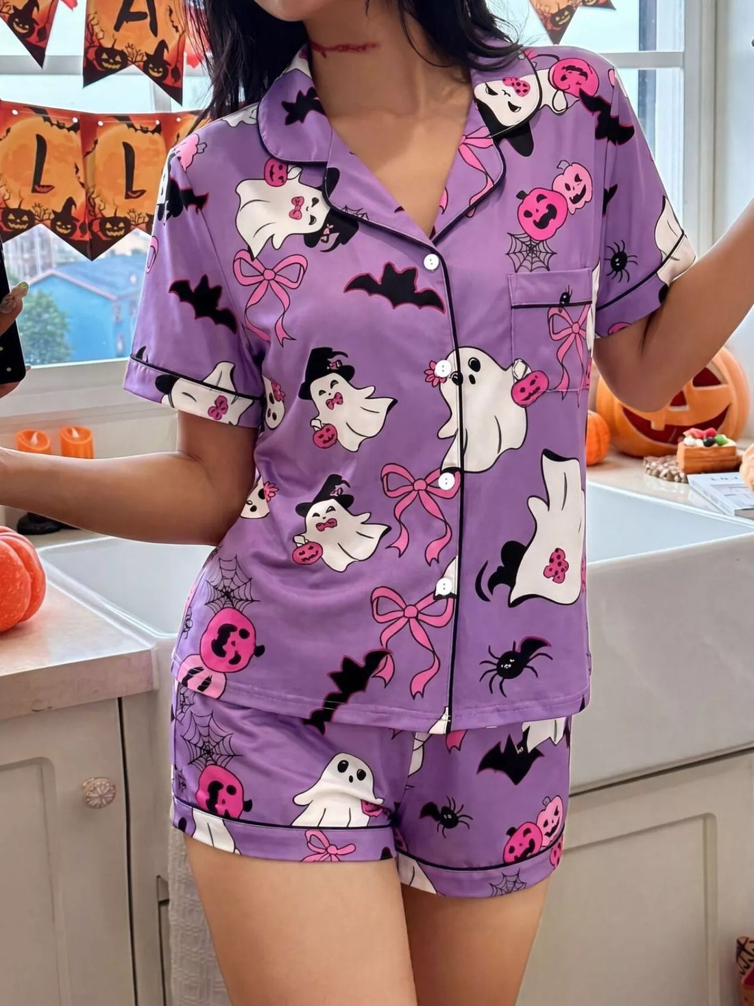 Purple Halloween lounge set with button-down short-sleeve top and matching printed shorts