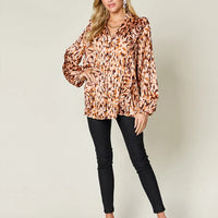 Caramel printed ruffle-trim balloon-sleeve tunic shirt with V-neck and button placket