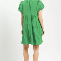 Green tiered babydoll dress, back view with puff sleeves