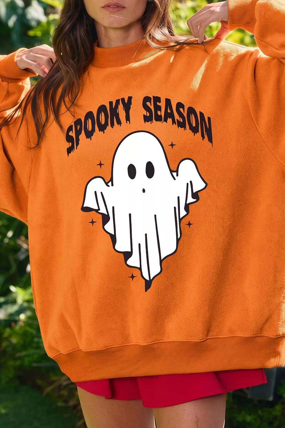 Orange mock neck sweatshirt with &