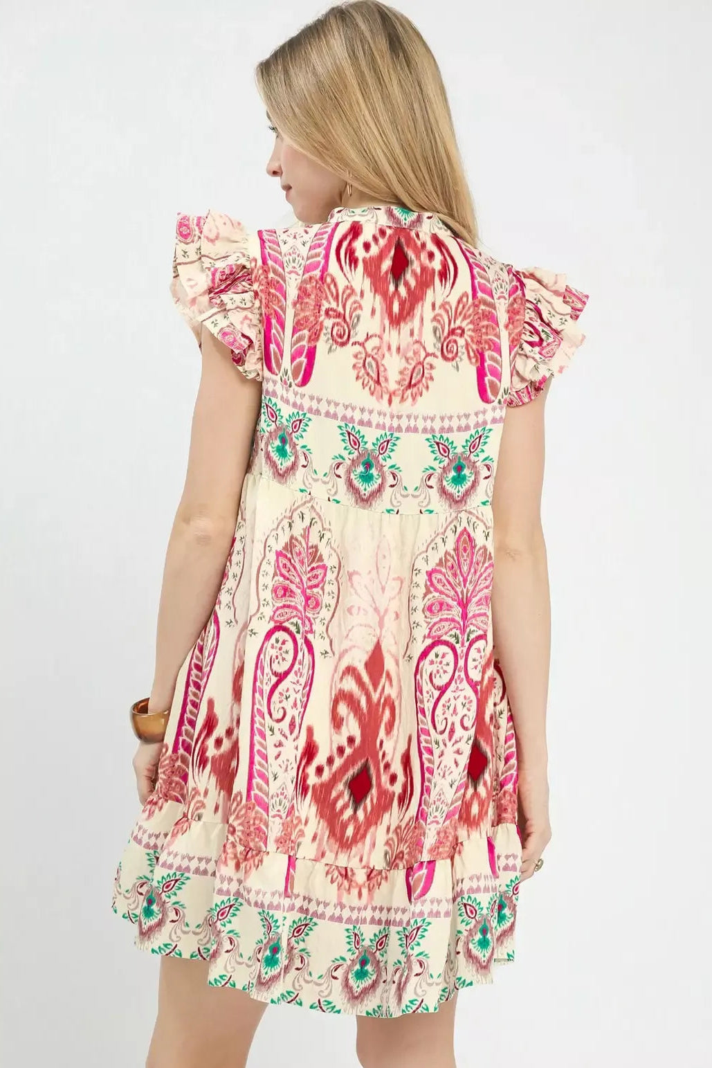 Boho print ruffle sleeve dress, back view, pink paisley pattern with teal border at hem