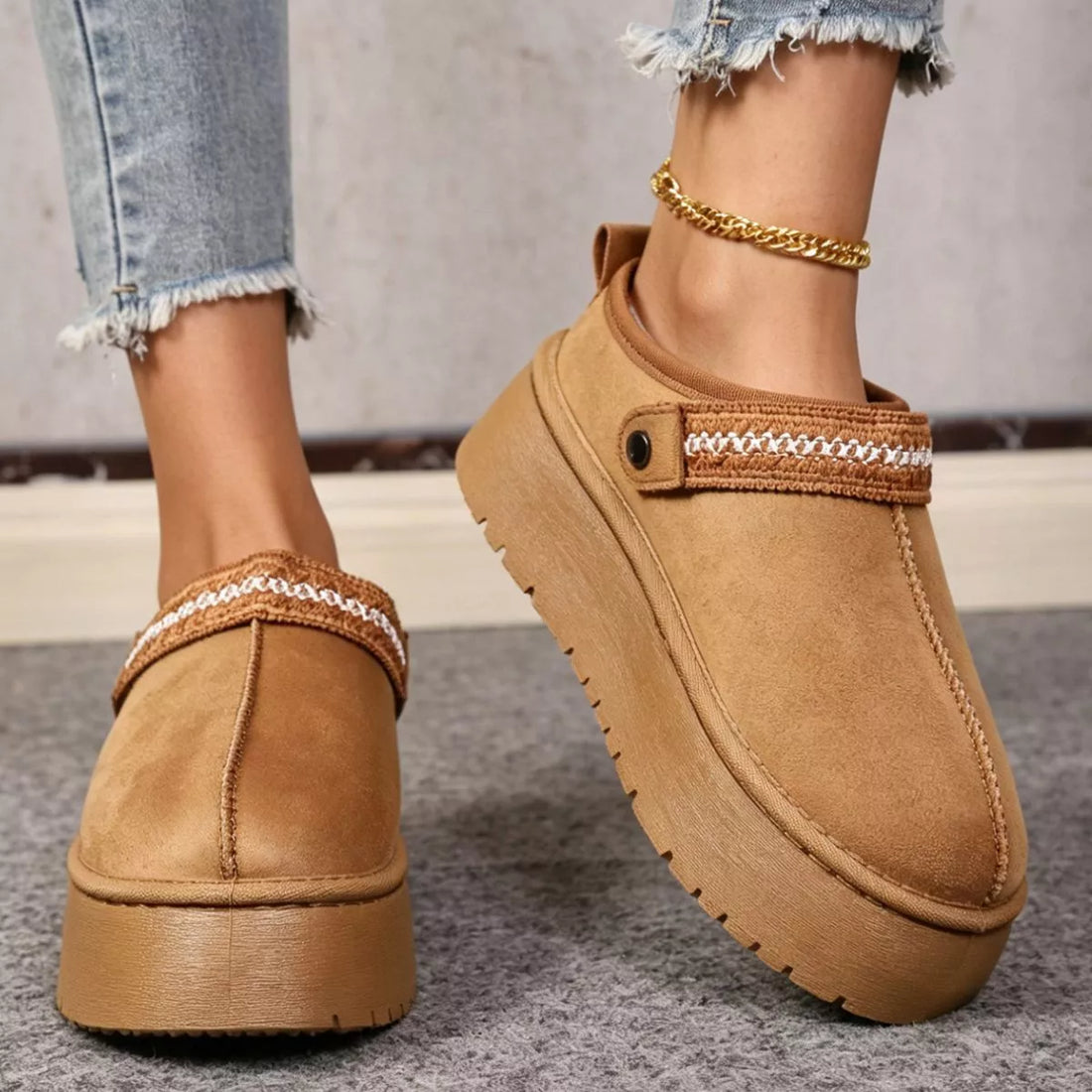 Camel suede fur-lined platform boots with patterned cuff trim and chunky sole.