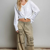 Off-white lightweight knit long-sleeve V-neck top with contrast trim