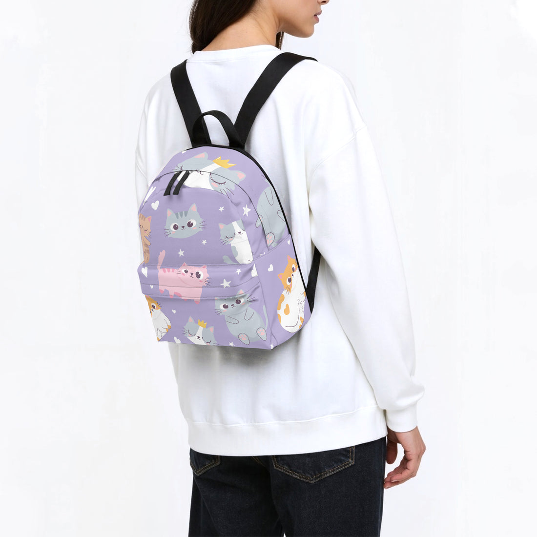Kids purple kitten-print backpack worn with black shoulder straps from behind
