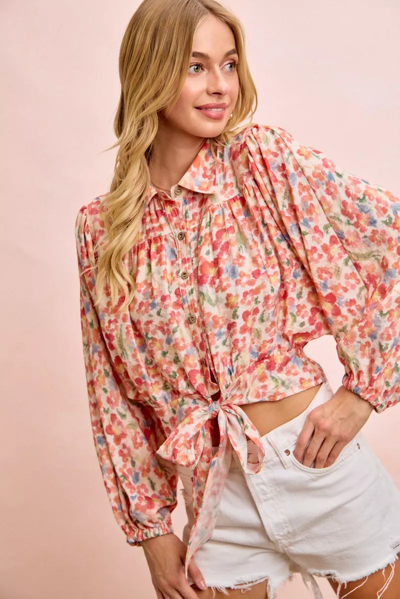 Floral print crop shirt with button front, puff sleeves, and tied hem detail