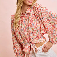 Floral print crop shirt with button front, puff sleeves, and tied hem detail