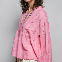 Pink eyelet lace blouse with split V neck and long sleeves; relaxed side silhouette