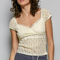 Natural lace short-sleeve top with sweetheart neckline and gathered texture