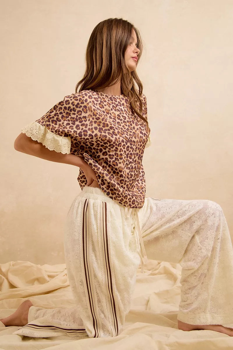 Leopard print top with lace-trimmed edges and cream striped lounge shorts