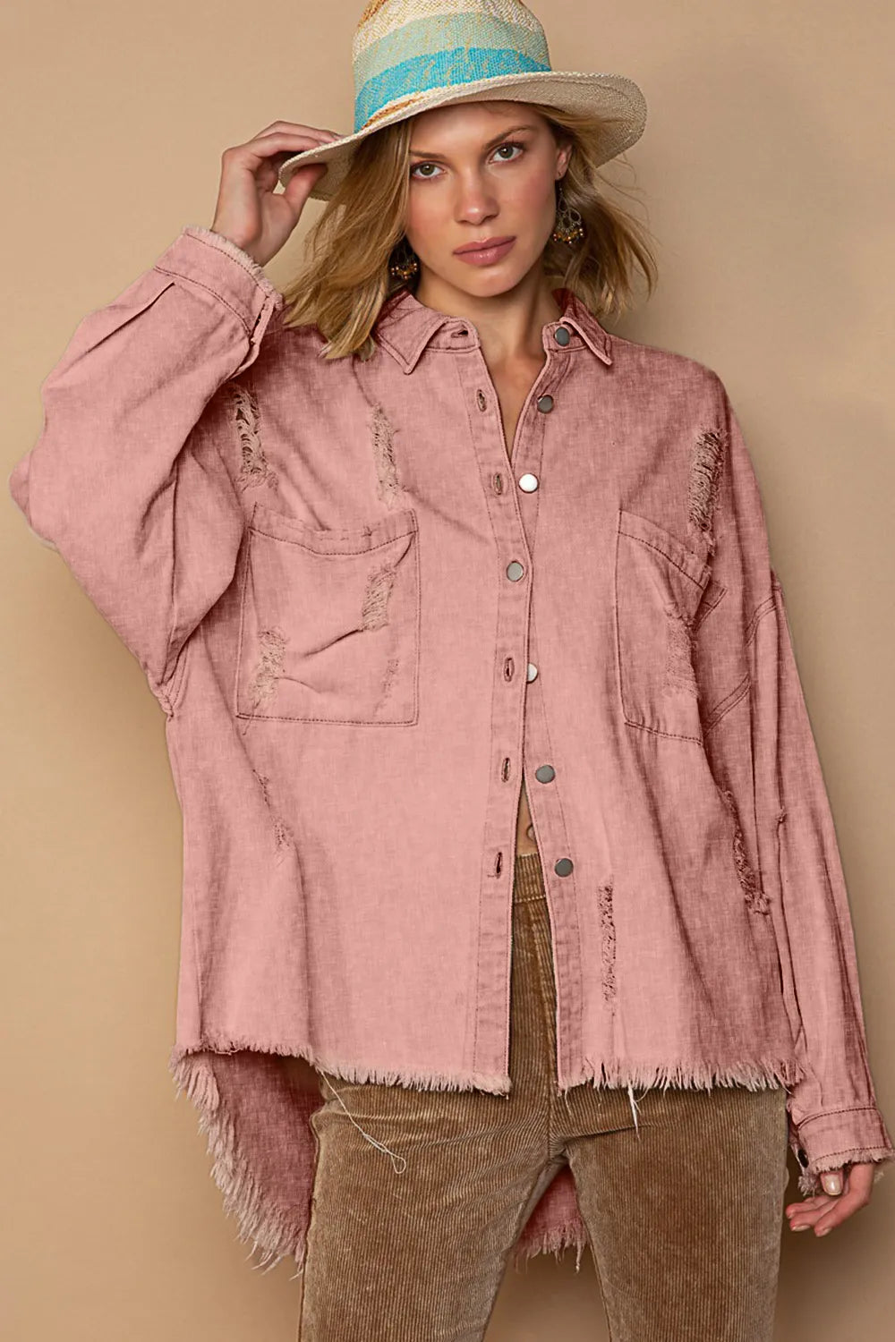 Powder brick distressed button-up shacket with button front and raw frayed hem