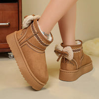 Camel suede platform boots with round toe, shearling lining, and zigzag trim