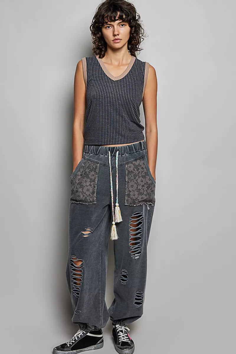 Dark ribbed V-neck sleeveless tank with contrast neckline and gathered hem