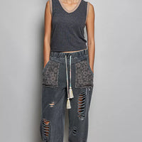 Dark ribbed V-neck sleeveless tank with contrast neckline and gathered hem