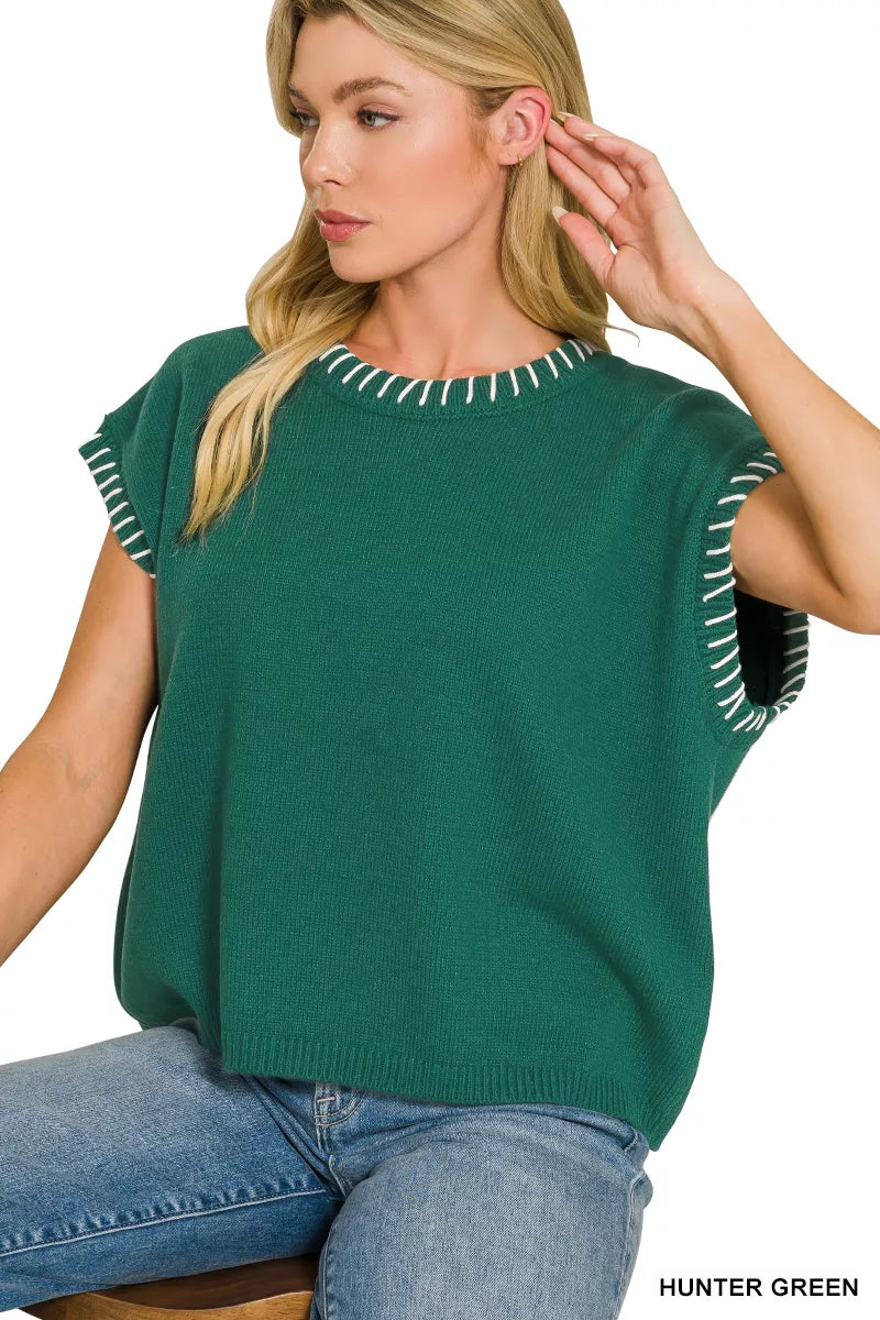 Hunter green oversize sweater with round neck and contrast stitched trim on short sleeves