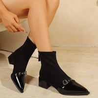 Black pointed-toe sock boots with buckle strap and chunky block heel