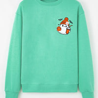 Turquoise crewneck sweatshirt with ghost and pumpkin embroidery, front view