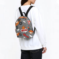 Grey monster truck backpack worn, black straps, orange truck and flame graphics on back