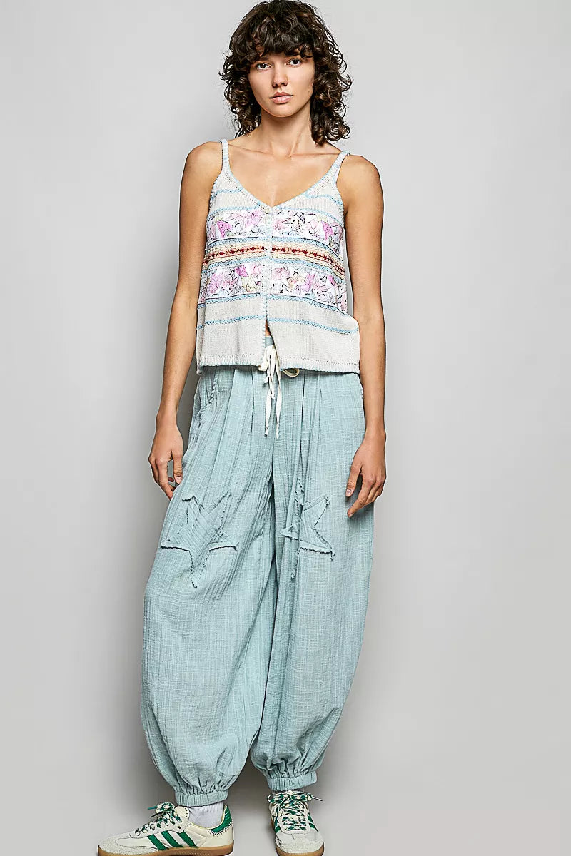 Cream and blue printed cami with button placket, tassels, and blanket-stitch trim