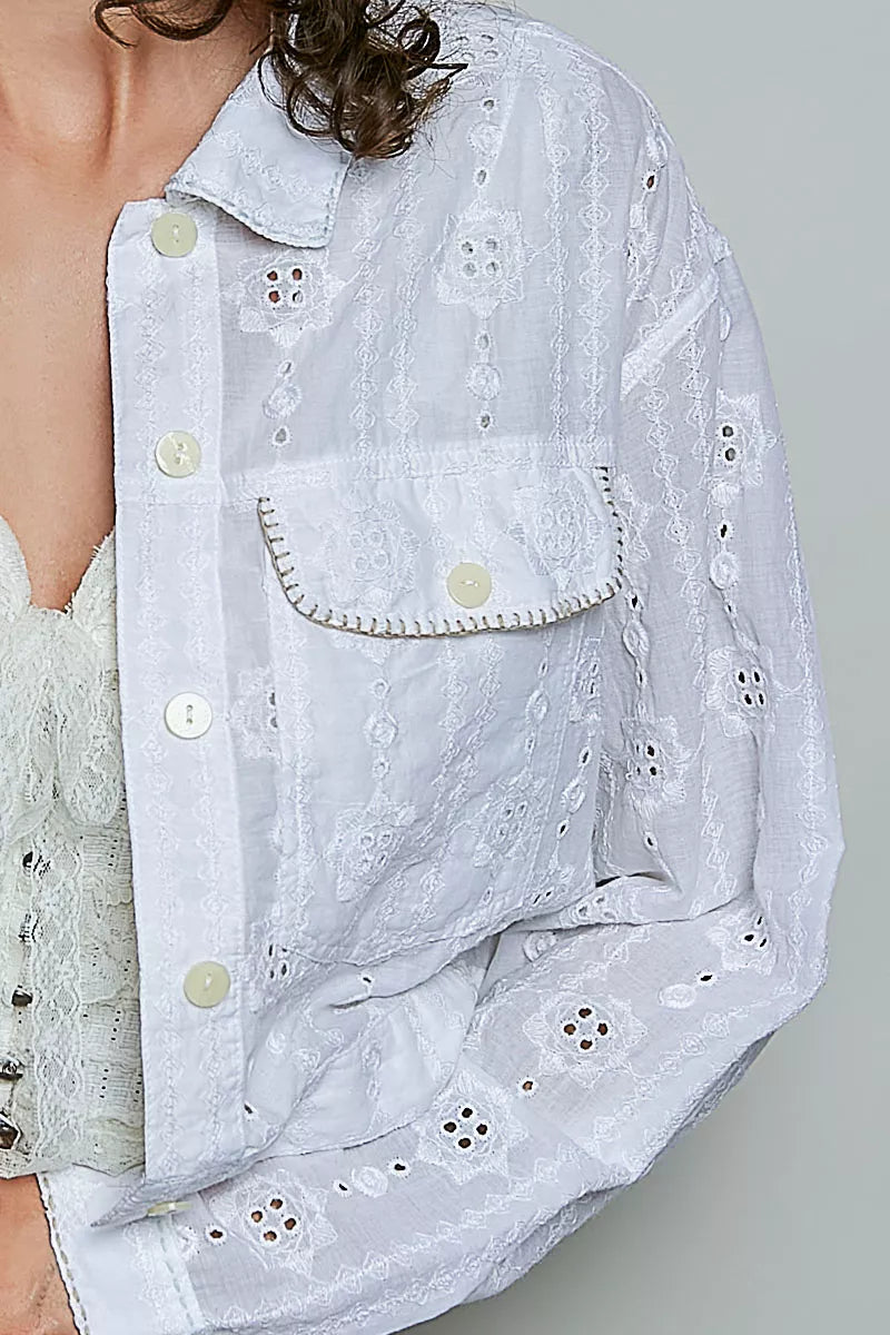 Off white eyelet textured button-front jacket detail with chest flap pocket and buttons