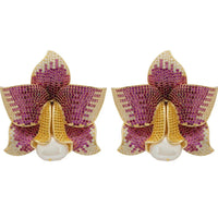 Gold-tone daffodil floral stud earrings with faux pearl drop and pink CZ accents