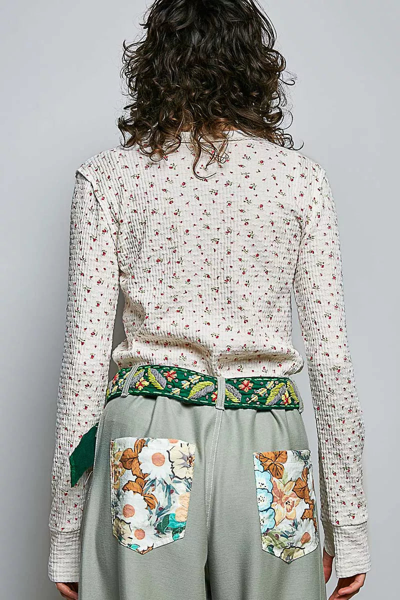 Ivory ribbed knit long sleeve top with tiny floral print, back view