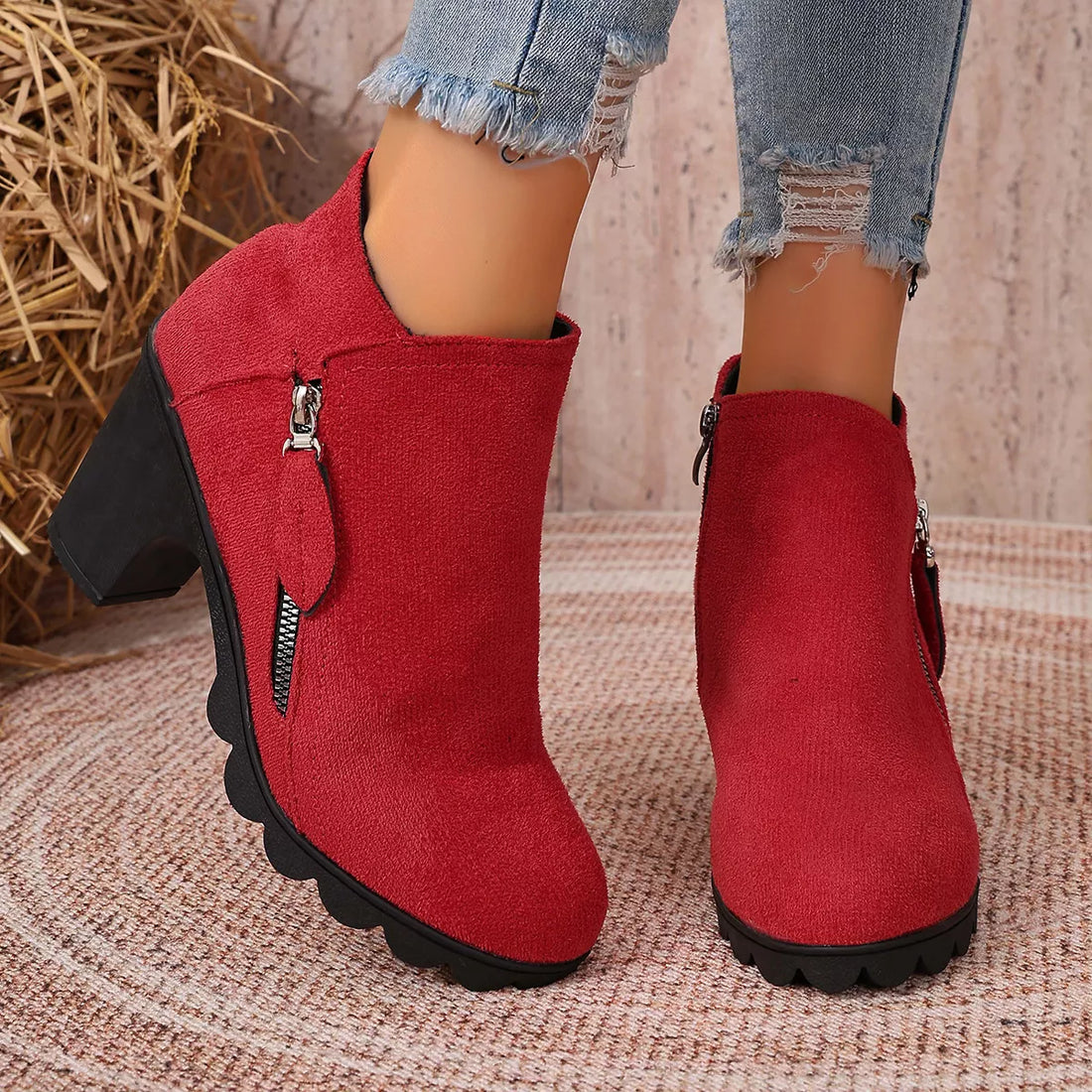 Red ankle boots with block heel, round toe, side zipper and decorative pull tab