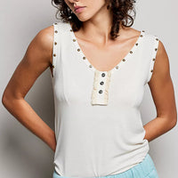 Cream sleeveless tank with studded V-neck and button placket ruffle detail