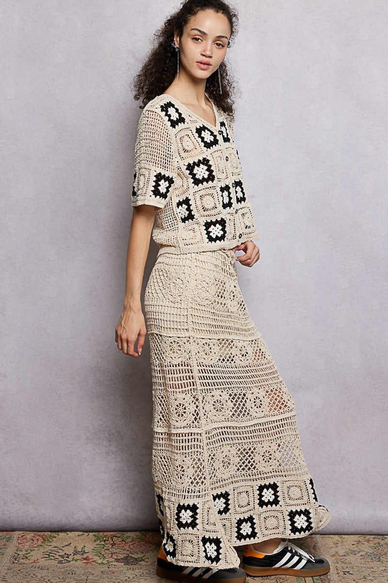 Natural crochet maxi skirt with black granny-square border and textured stripe panels