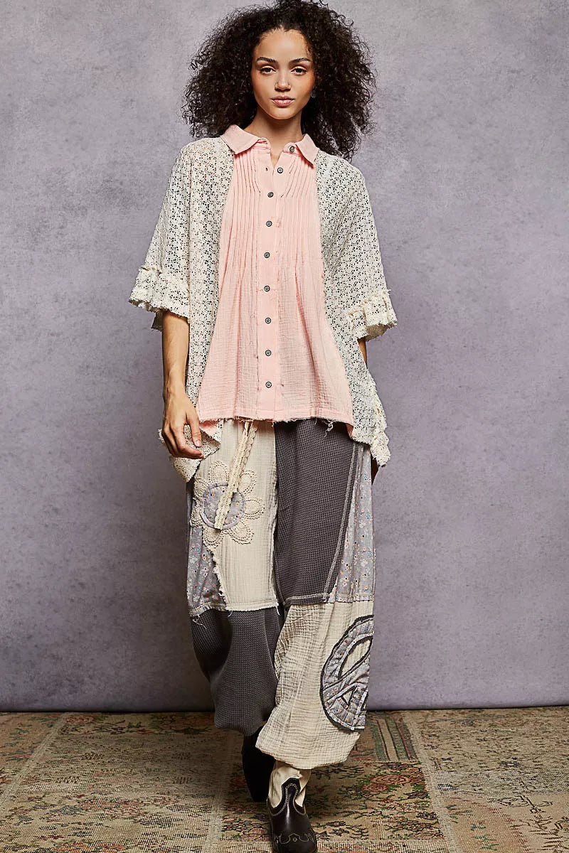 Women’s baby pink button-front pleated shirt with lace crochet patch and ruffled hem