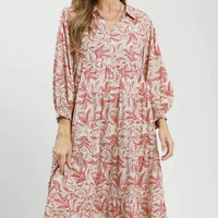 Tiered midi dress with pink botanical print, long sleeves, and tiered skirt