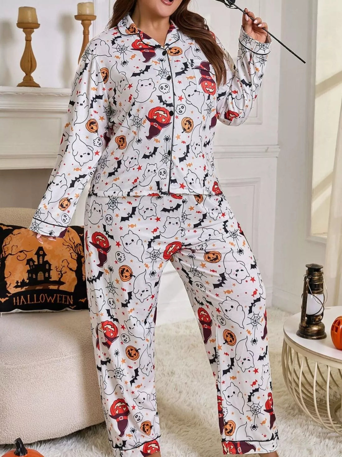Plus size Halloween pajama set with white long-sleeve top and matching printed pants